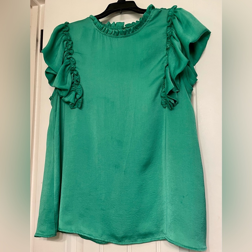 Glam green top with beautiful frill detail around neck & arms. Size L